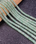 Fresh Hand Polished Natural Fluorite Stone Beads Cylinder Abacus Shape Loose Spacer Gems Dope DIY Bracelet And Necklace Jewelry Making Supplies Craft Kit 2X6MM laid out on a surface.