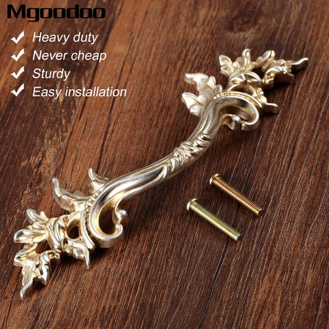 5 Pcs French Provincial Drawer Pulls In Warm Antique Gold Finish Top Shelf Zinc Alloy Cabinet Handles With Quick Grip Heavy Duty Build For Kitchen Cupboards And Dressers Real Deal Vintage Hardware Upgrade For Your Home Decor Project. Close-up view of ornate gold drawer pull with screws.