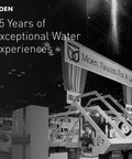 Moen exhibition booth celebrating 85 years of exceptional water experiences with faucets display.