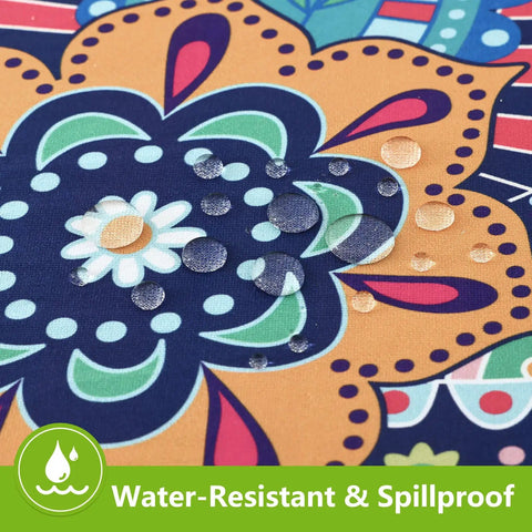 Close-up of water droplets on blue and orange Paisley Fitted Spandex Tablecloth For 6 Foot Rectangle Tables With Elastic Edge 30x72.