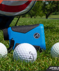 Slope Smart Golf Rangefinder Locks Down Fairway Distances Up To Eight Hundred Yards Handles Hilly Terrain Smoothly And Delivers Ball Park Precision For Weekenders Available In Sleek Blue on grass with golf balls nearby.