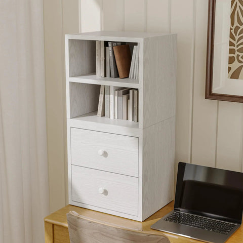 Stackable Cube Storage Organizer For Home And Office DIY Modular Shelving Cubes For Books Clothes Toys And Decor Built With Sturdy 18mm Panels Hidden Bolts Anti Tip Kit Mortise And Tenon Joints Free Stacking Design In White Washed Finish on a desk with books and decor