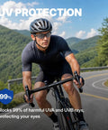 Real Deal ANSI Z87 Certified Safety Glasses Featuring Impact Resistant Anti Fog And Scratch Resistant Polycarbonate Lenses worn by cyclist on mountain road.
