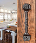 Sliding Barn Door Handles Set Of 4 In Dark Brown Cast Iron With Vintage Rustic Finish installed on wooden kitchen door