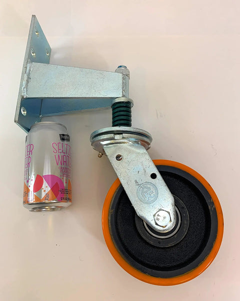 Heavy Duty 6X2 Inch Gate Caster With Spring Suspension And Full 360 Degree Swivel Wheel Handles 880 Pounds with mounting plate and can for scale.