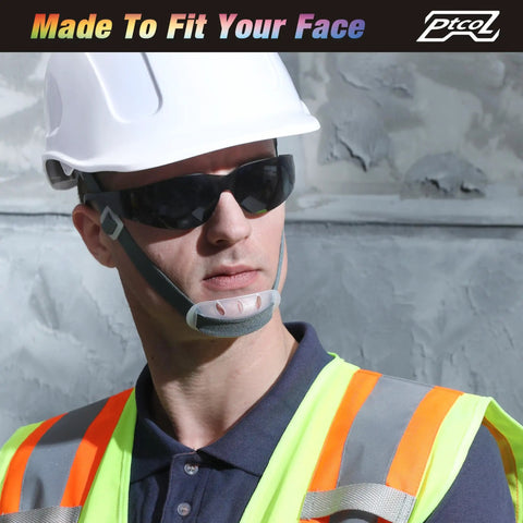 Man wearing Badass Bulk Pack Safety Glasses Polycarbonate Lenses Black Tinted Antiscratch Impact Resistant ANSI Certified Work Eye Protection.