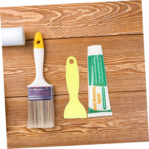 Two Set Wall Mending Cream Kit Quick Drying Drywall Crack Repair Paste With Scraper and brush on wooden surface