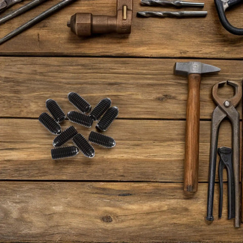 Ten Piece Heavy Duty Carbon Steel Ball Plunger Screws Featuring Internal Hex Quick Setup Design For Lock Tight Bead Positioning And No Fuss Mounting Black Hardware Collection on wooden surface.