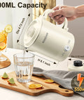 Grab And Go Portable Travel Kettle 600ml with Foldable Handle Electric Kettle pouring into glass, food grade stainless steel