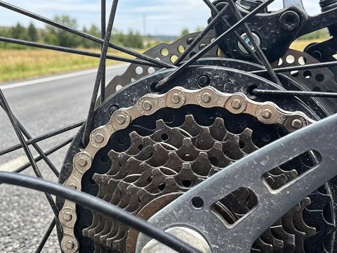Close-up of bike rear wheel with chain from All In One Bike Chain Tool Kit For Six Seven Eight Speed Chains With 126 Link Replacement