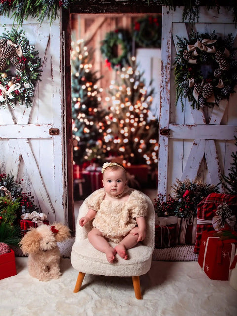 Slick White Barn Door Photography Backdrop For Studio Sessions And Indoor Portraits Seamless Microfiber Photo Background Wall Cover With Light Blocking Build And Zero Sweat Setup For Clean Shots featuring a baby and decorated holiday scene.