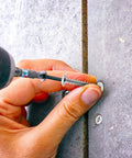 Using a drill to insert a screw from 50 Sets Drywall Anchors And Screws Kit With Self Drilling Design In High Hardness Nylon And Iron