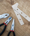4 Pack Frameless Pivot Hinges for Hidden Doors And Cabinets With Thickened Design on wooden surface with hand tools nearby.