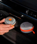 Hand holding V16 Approved Led Emergency Warning Beacon Offering Knockout Night Visibility With Rock Solid Magnetic Base.