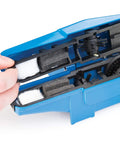 Open CM25 Professional Chain Scrubber Tool For Bike Chains Shop Grade With Four Sided Scrubbing Action showing interior brushes.