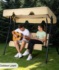 Outdoor Porch Swing With Adjustable Canopy And Heavy Duty Stand, beige cushions, two people seated, in garden setting