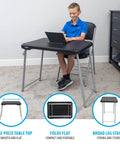 Boy using Stacking Compact Folding Table 30 By 20 Inches For Indoor And Outdoor Use Portable Black And Silver Folding Table in room