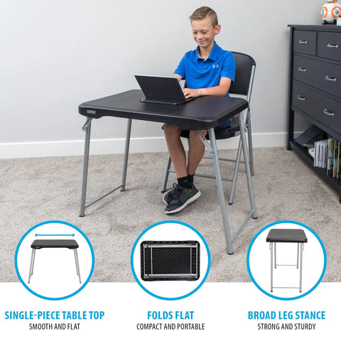 Boy using Stacking Compact Folding Table 30 By 20 Inches For Indoor And Outdoor Use Portable Black And Silver Folding Table in room