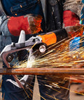 Belt Sander Adapter For Angle Grinder Five Eighths By Eleven Thread Pipe Sanding Attachment with sparks flying during metalworking.