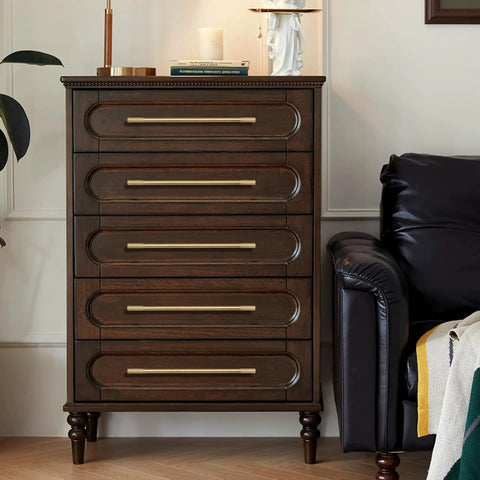 Top Tier Solid Brass Cabinet Pulls With Brushed Gold Finish on a dark dresser with five drawers in a cozy living space.