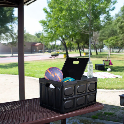 Big Time Heavy Duty Collapsible Storage Bin With 16 Gallon Capacity, Folds Flat Easy, holding sports balls in a park setting.