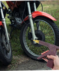 Complete Heavy Duty Motorcycle Tire Repair Kit Featuring Abs Metal Plug Insertion Tool next to motorcycle wheel on grass.