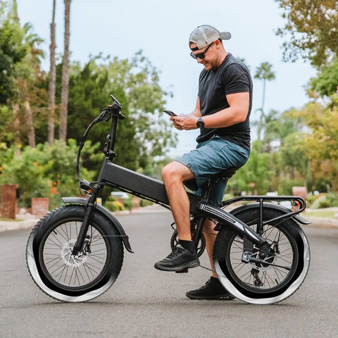 Cyclist on e-bike showing Two Pack Self Sealing Fat Bike Inner Tubes For 20 By 3.0 And 3.5 Tires With 32mm Schrader Valve Puncture Resistant Auto Repair Tubes