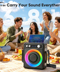 Group of friends using All In One Karaoke System With Two Wireless Microphones Portable Bluetooth Speaker at a picnic