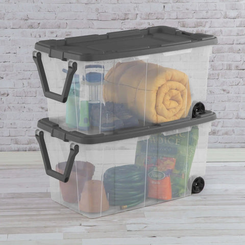 Rugged Pull Along 160 Quart Rolling Storage Tote With Transparent Bottom showcasing stacked clear crates filled with various items.
