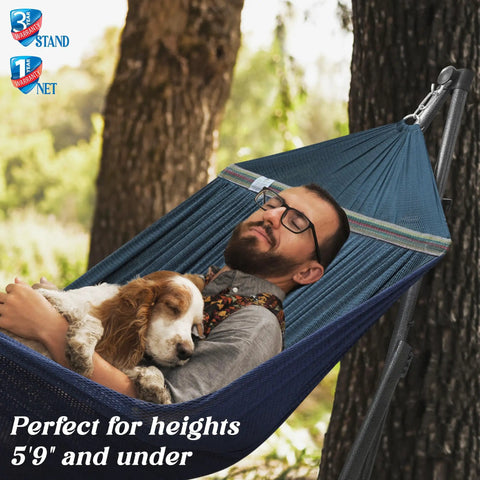 Man relaxing with dog in Adjustable Hammock With Sturdy Collapsible Stand For Camping And Outdoor Use 550 Lb Capacity Double Hammock