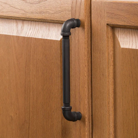 Vintage Bronze Kitchen Cabinet Pulls, Rustic Industrial Drawer Handles For Dressers And Cupboards mounted on oak cabinet door.