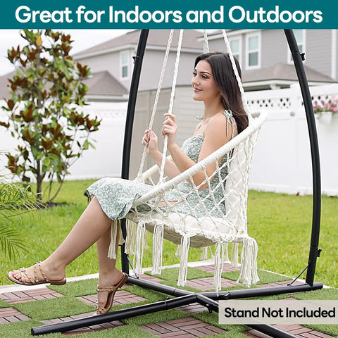Woman sitting in Macrame Hammock Chair Hanging Swing For Indoor Outdoor Use 330 Lbs Capacity Handwoven Cotton Rope with Cushions