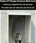 Tough As Nails Outdoor EV Charger Cover Waterproof Galvanized Steel EV Plug Protector under rain, mounted on wall.