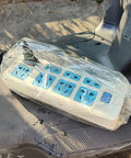 No Sweat EV Charger Cover For Your Ride Rock Solid Waterproof Housing keeps a plug box secure and dry in plastic wrap.