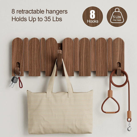 Walnut Wood Coat Rack Wall Mount With Eight Retractable Hangers And Two Dedicated Key Hooks displaying keys, bag, and leash