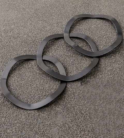 Heavy Duty Steel Wave Washers Five Piece Set For Bike Bottom Bracket Crank Stabilizer Rust Proof Spring Washers laid out on a surface.