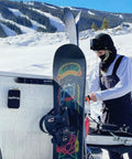 Badass Magnetic Ski And Snowboard Vehicle Rack Keeping Your Ride Spotless With Soft Waterproof Padding For Reliable All Season Winter Storage And Trail Ready Adventures in use with snowboard.