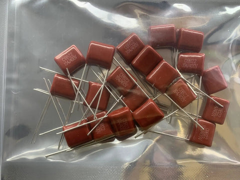 Heavy Duty CBB22 Capacitor Assortment Kit Packs Twenty 400V 0.1 Microfarad 104J red metallized polypropylene capacitors in a bag.