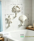 Heavy Duty Cast Iron Coastal Wall Hooks Set of 3 Legit Retro Charm with crab, starfish, and seashell in bathroom setting.