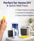 Hand applying Upgraded Wall Repair Paste With Scraper Quick Drying Wall Patch For Holes and Cracks on indoor wall surface