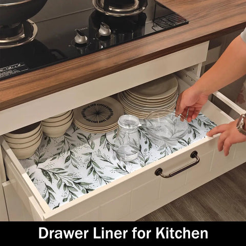 Top Shelf Non Adhesive Shelf Liners For Pantries Drawers And Closets With Nonslip Texture Durable Material Easy To Trim And Slide Into Place Every Single Time No Fuss Home Setup Game Changer in a kitchen drawer with plates and jars.