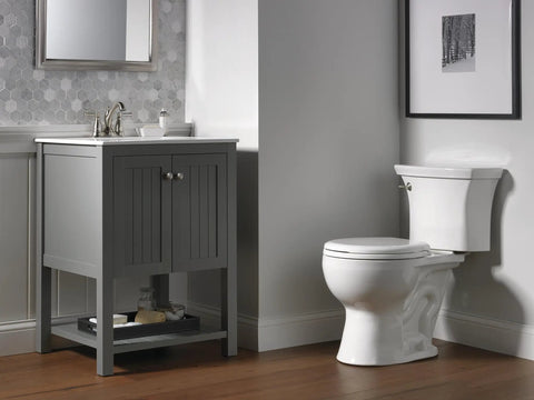 Bathroom with Linden Centerset Chrome Bathroom Faucet With Diamond Seal Technology on gray vanity next to white toilet.