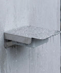 Rock Solid Outdoor EV Charging Station Protector Stainless Steel Cover with rain droplets and weather resistance on wall.