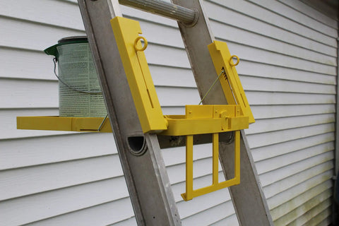 Universal Ladder Tray Rack Fits Extension And Step Ladders Heavy Duty Mid Section Tool Shelf Holds Twenty Pounds Quick Clamp Setup on ladder with paint can.