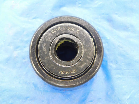 Rock Solid Cam Yoke Roller Bearing With Lubri Disc Seal 1 3/4 Inch Outer Diameter And Half Inch Inner Bore on blue background.