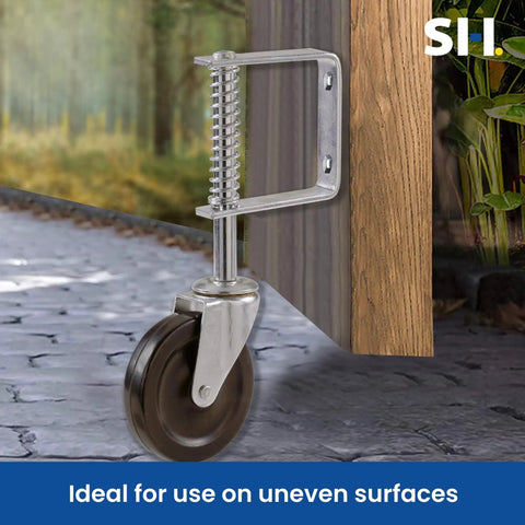 Top Shelf Heavy Duty Spring Loaded Swivel Gate Caster With Kickin 4 Inch Black Polyurethane Wheels, showing the spring mechanism and wheel on rough surface.