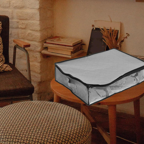 3 Pack Underbed Storage Bags Fabric Foldable Clothes Organizer Non Woven Material on a table in a cozy room setting.
