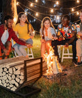 Built Tough Dope Firewood Rack For Indoor And Outdoor Use 31 Inch Log Holder stands near a campfire with friends.