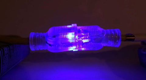 Close-up of Heavy Duty 30 Ft Extension Cord With Sharp Blue Led Lights On Both Ends for high visibility and flex usage.