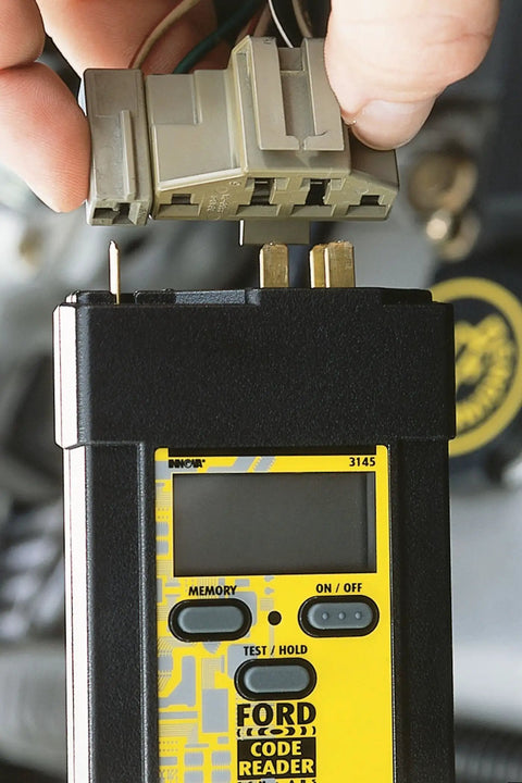 Ford OBD1 Diagnostic Code Reader with digital display for 1982 to 1995 Ford Lincoln Mercury cars, connector detail.